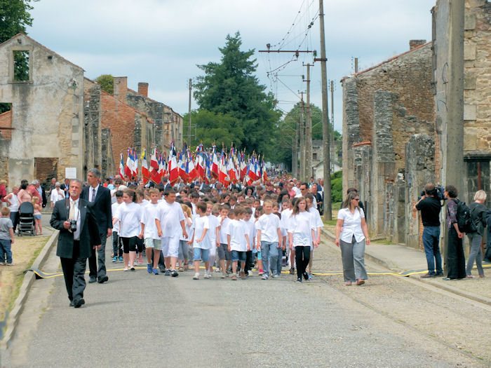 March through the ruined village of Oradour-sur-Glane